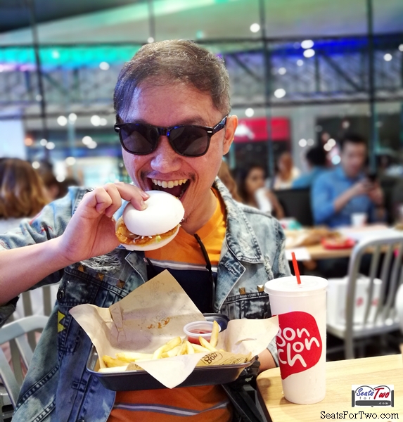 Jonel of Seats For Two enjoys his Gangnam Bao