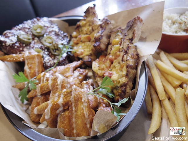 tray of pork ribs, chicken wings, pork chops